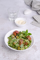 Wall Mural - Pasta with vegetables and sausages