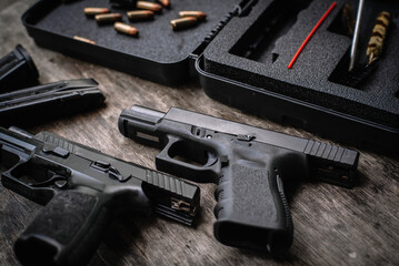 Wall Mural - Disassembly and cleaning Maintaining a 9mm semi-automatic pistol on a wooden table.