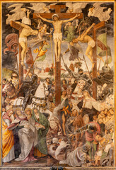 Fototapete - VARALLO, ITALY - JULY 17, 2022: The renaissance fresco of Cricifixion in the church Chiesa Santa Maria delle Grazie  by Gaudenzio Ferrari (1513).