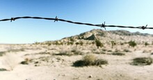 Slowly Panning A Rusted Barbed Wire Fence In An Arid Desert - Lancaster, California