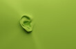 © Andreas Berheide - Green ear on a green background, health care or alertness concept, 3d render