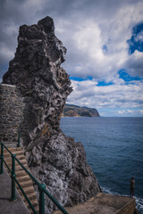 Wall Mural - Scenic view of the atlantic ocean at Ponta do Sol, Madeira. Rock, ocean and fisher. October 2021