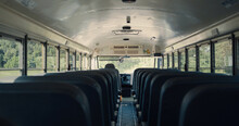 Interior Empty School Bus Closeup. Rows Seats Inside Safety Public Transport.