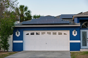 Wall Mural - Wide garage double door and concrete driveway of new modern american house