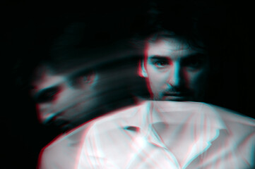 Abstract blurry portrait of a schizophrenic man with mental disorders and bipolar split personality. Black and white with 3D glitch virtual reality effect