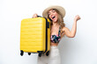 © luismolinero - Girl in swimsuit in summer holidays isolated on white background in vacation with travel suitcase