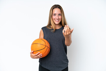 Young basketball caucasian player woman isolated on white background inviting to come with hand. Happy that you came