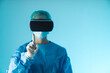 © PoppyPix - Surgeon doctor wearing virtual reality or augmented reality glasses to perform a futuristic surgery, holding up an index finger. High quality photo