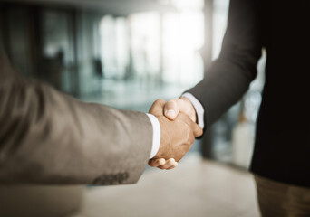 Leinwandbilder - A professional handshake after an interview meeting for a company in a modern corporate office. Formal executive businessmen shaking hands after a successful collaboration leading to a job promotion