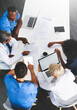 © Delmaine Donson/peopleimages.com - Doctors, medical professionals or healthcare workers with laptop talking, meeting or planning hospital medicine treatment. Above view of diverse group of physician colleagues brainstorming with tech