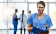 © Delmaine Donson/peopleimages.com - Doctor, medical professional and worker reading from a file, folder or form while working at a hospital. Portrait of a nurse or surgeon checking information, filling in paperwork and holding a report