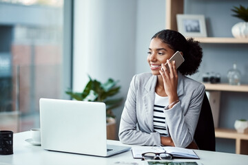 Poster - Business woman talking on phone call or young entrepreneur answering cellphone in front of laptop in work office. Happy, African American female smiling and receiving good news while sitting at desk.