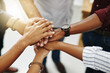 © D Donson/peopleimages.com - Business people hands stacked showing unity, teamwork and collaboration gesture for a project goal at a team meeting. Group closeup of corporate workers joining, working together and standing united