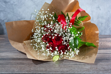 Wall Mural - A view of a bouquet of a dozen red roses.
