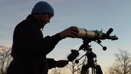 Wall Mural - man, telescope, stars, moon and countryside under evening skies.