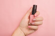 Nail polish in a woman's hand copy space. Article about manicure. Gel polish. Hand care .