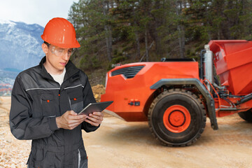 Aufkleber - Engineer programs autonomous mining truck using digital tablet	