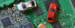 Toy cars on electronic board and microchip. Conceptual image for semiconductor shortage disrupting production of the automotive industry. long banner web image
