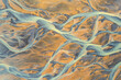 © AmazingAerialAgency - Aerial view of a water abstract pattern from a river estuary in Iceland.