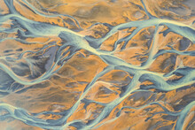 Aerial View Of A Water Abstract Pattern From A River Estuary In Iceland.