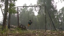 A Alone Boy On Swing
