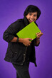 © Dip Photography - Young happy man holding and posing with the book on background.