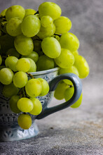 Close-up Of Green Grapes In A Teacup