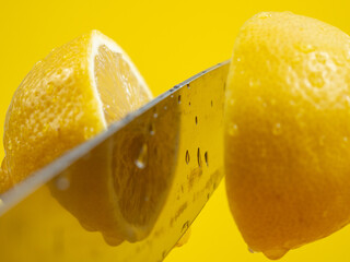 Cut the lemon with a knife in the air.