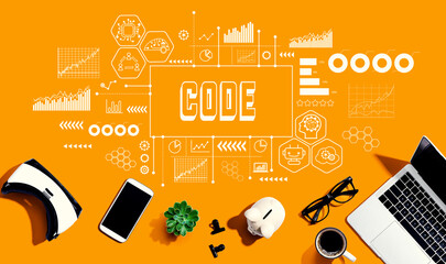 Code with electronic gadgets and office supplies - flat lay