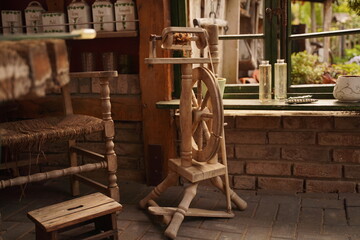 A wooden spindle stands in an old house