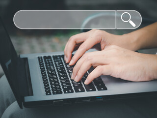 Wall Mural - search a young woman using a laptop to search for information using search console, a large database