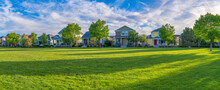 Residential Area At Daybreak, Utah With Large Green Fied At The Front