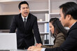 © BritCats Studio - Asian men manager scold and angry with their employee inside of office meeting room with upset and stress worker. Business failure. Problem in working office, Negative emotion workplace.