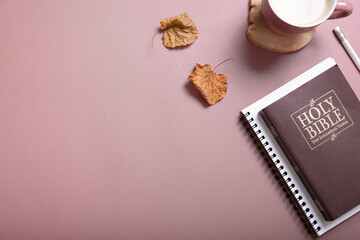 personal bible study with a cup of coffee and autumn leaves top view. holy bible study concept.
