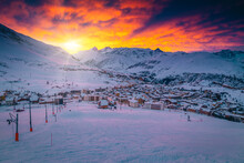 Colorful Clouds Over The Ski Resort At Sunrise, France