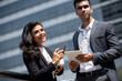 © Atstock Productions - Indian businessman meeting with businesswoman outdoors in the city