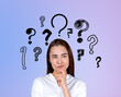 © ImageFlow - Businesswoman portrait with curious and pensive look, set of question marks