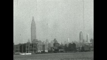 Empire State Building 1931 - The Empire State Building Is Seen From A Ferry On The East River As It Passes Bellvue Hospital In 1931. 