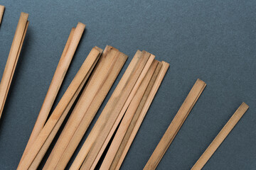 Canvas Print - tips of vintage cedar wood straps on blank paper