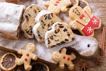 Wall Mural - Traditional christmas stollen cake on a wooden board