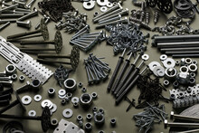 Set Of Bolts Nuts Nails Metal Fasteners. Consumable Hardware Tools. Assortment Steel Screws Collection Close Up Background