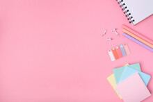The Concept Of Back To School. School Stationery On A Pink Background. Selective Focus. Background