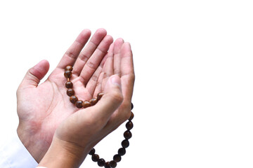 Religious muslim islam man in white session lift two hand for praying to Allah in mosque, isolated on dark background.concept for islamic pray, Ramadan, Eid al Fitr, eid ad-ha, meditation