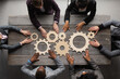 © alotofpeople - Business people joining gears