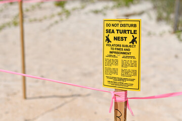 Sea turtle nesting sign on the beach in Florida