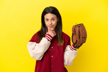 Wall Mural - Young caucasian woman playing baseball isolated on yellow background thinking