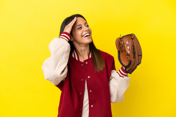 Wall Mural - Young caucasian woman playing baseball isolated on yellow background smiling a lot