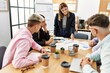 © Krakenimages.com - Group of business workers listening hispanic boss woman conference at the office.