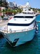 Front view from above of a white yacht moored in the port of Mahon on the island of Menorca, Spain