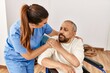 © Krakenimages.com - Senior man sitting on wheelchair and geriatric nurse at rehabilitation clinic